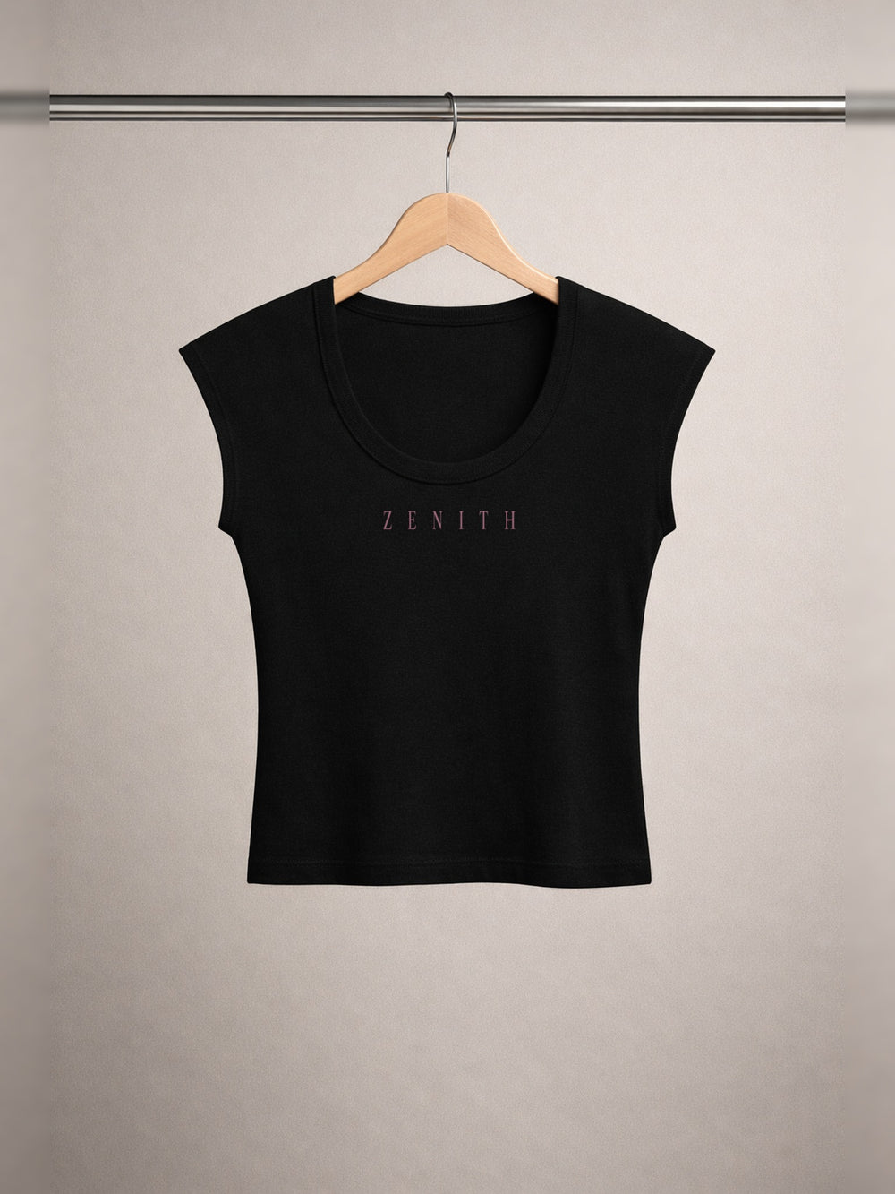 Daughter of Christ Baby Tee — Onyx Black — chest side, studio hanger