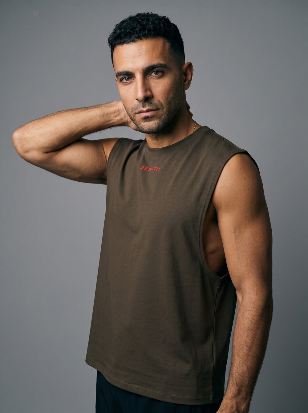 The Embrace Performance Tank in Espresso Brown, angled view showing the armhole and side seam