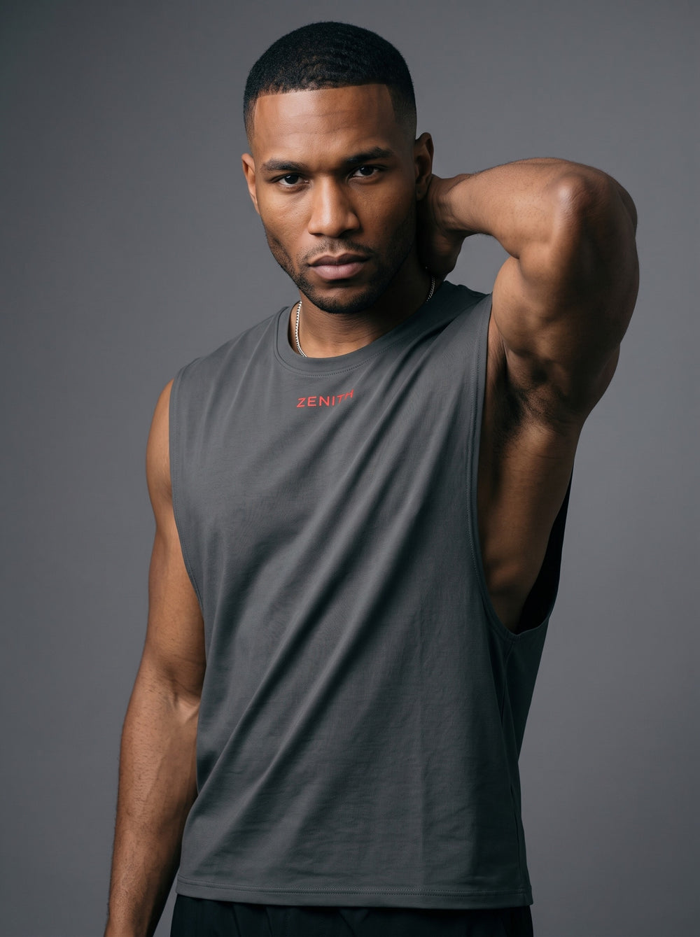 The Embrace Performance Tank in Graphite Gray, angled view showing the armhole and side seam