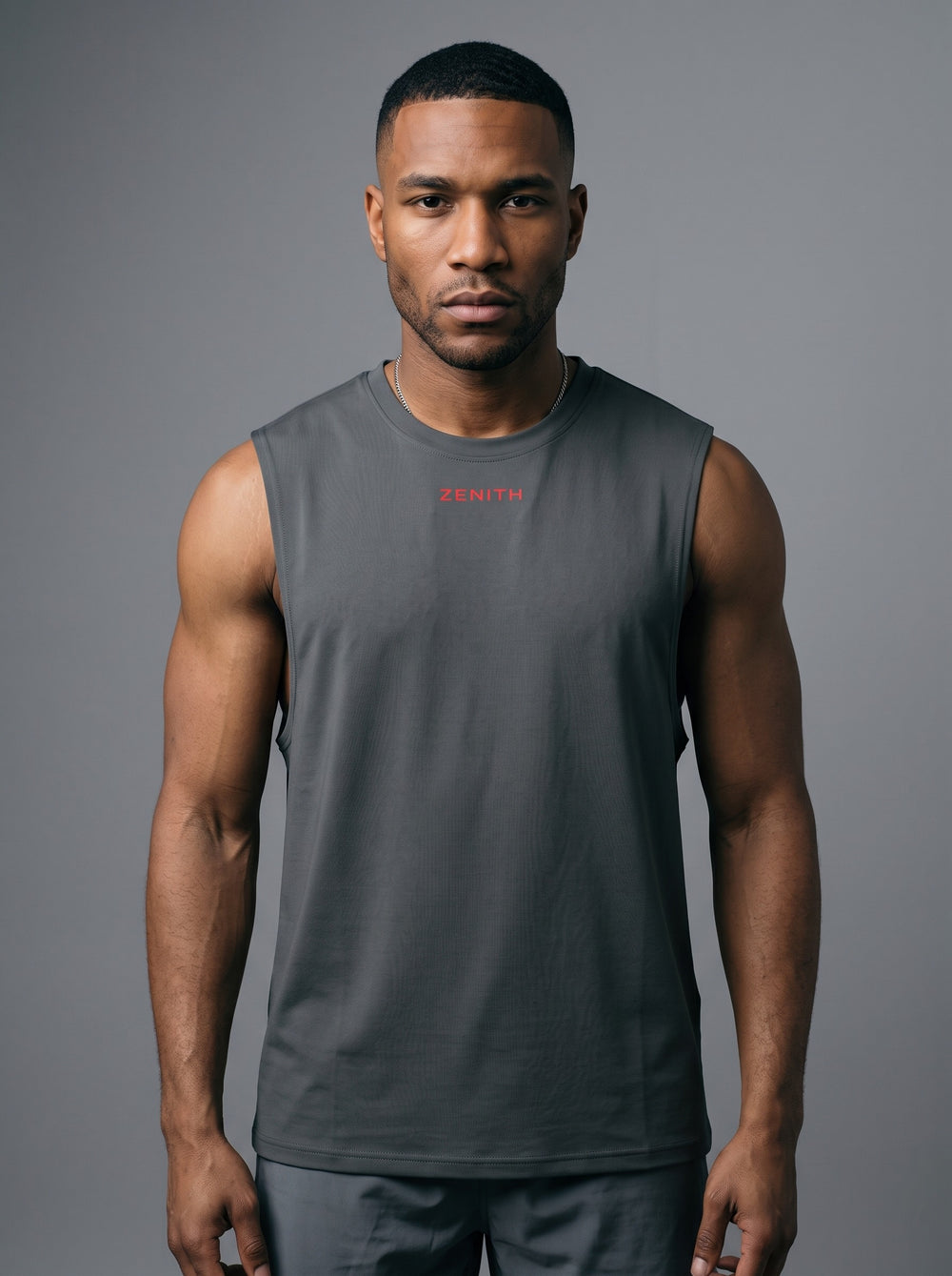 The Embrace Performance Tank in Graphite Gray, front view showing the ZENITH chest mark