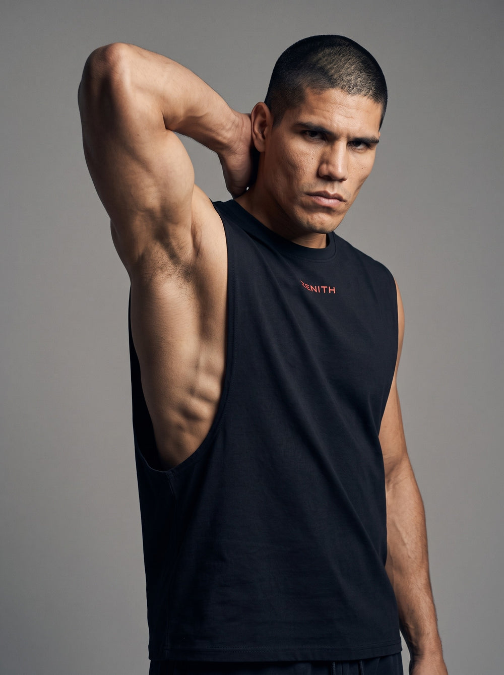 The Embrace Performance Tank in Onyx Black, angled view showing the armhole and side seam