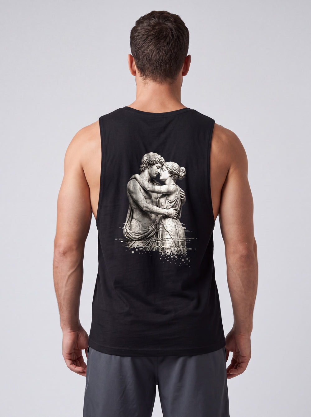 The Embrace Performance Tank in Onyx Black, back view showing the full-width greyscale sculpture print